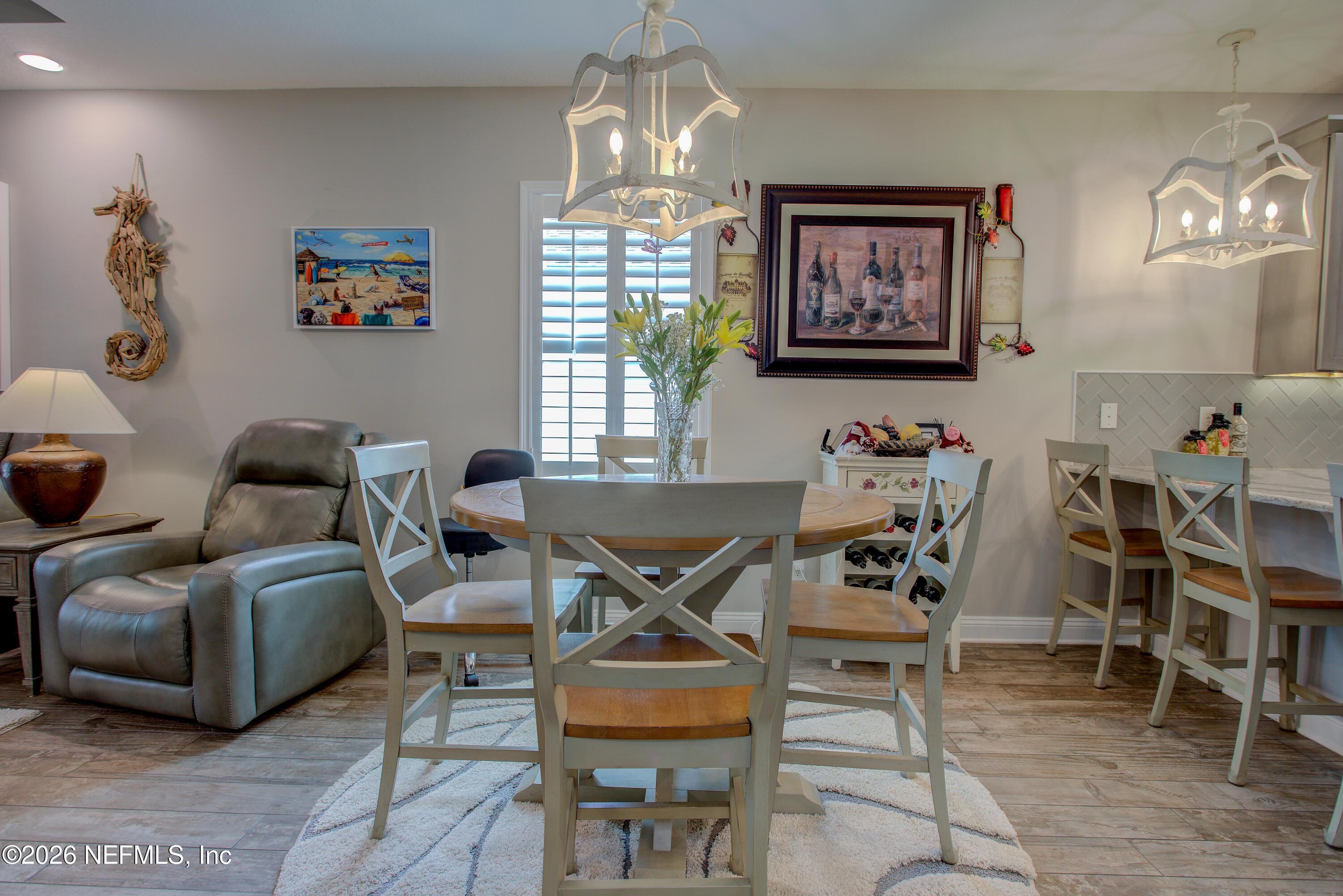 394 Balearics Drive St. Augustine, FL 32086 - Photo 11 of 26 a living room with furniture and a chandelier