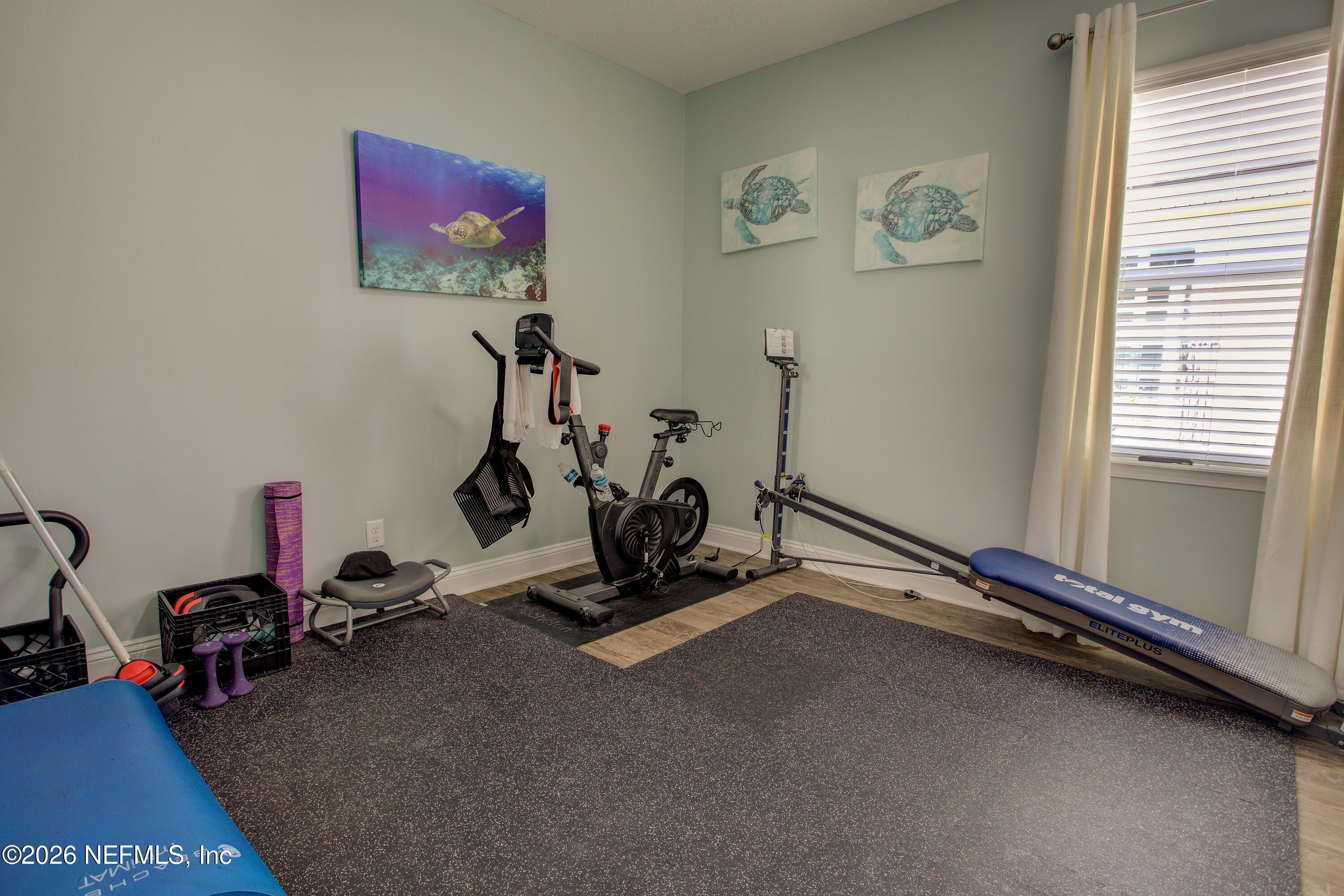 394 Balearics Drive St. Augustine, FL 32086 - Photo 15 of 26 a room with gym equipment and windows