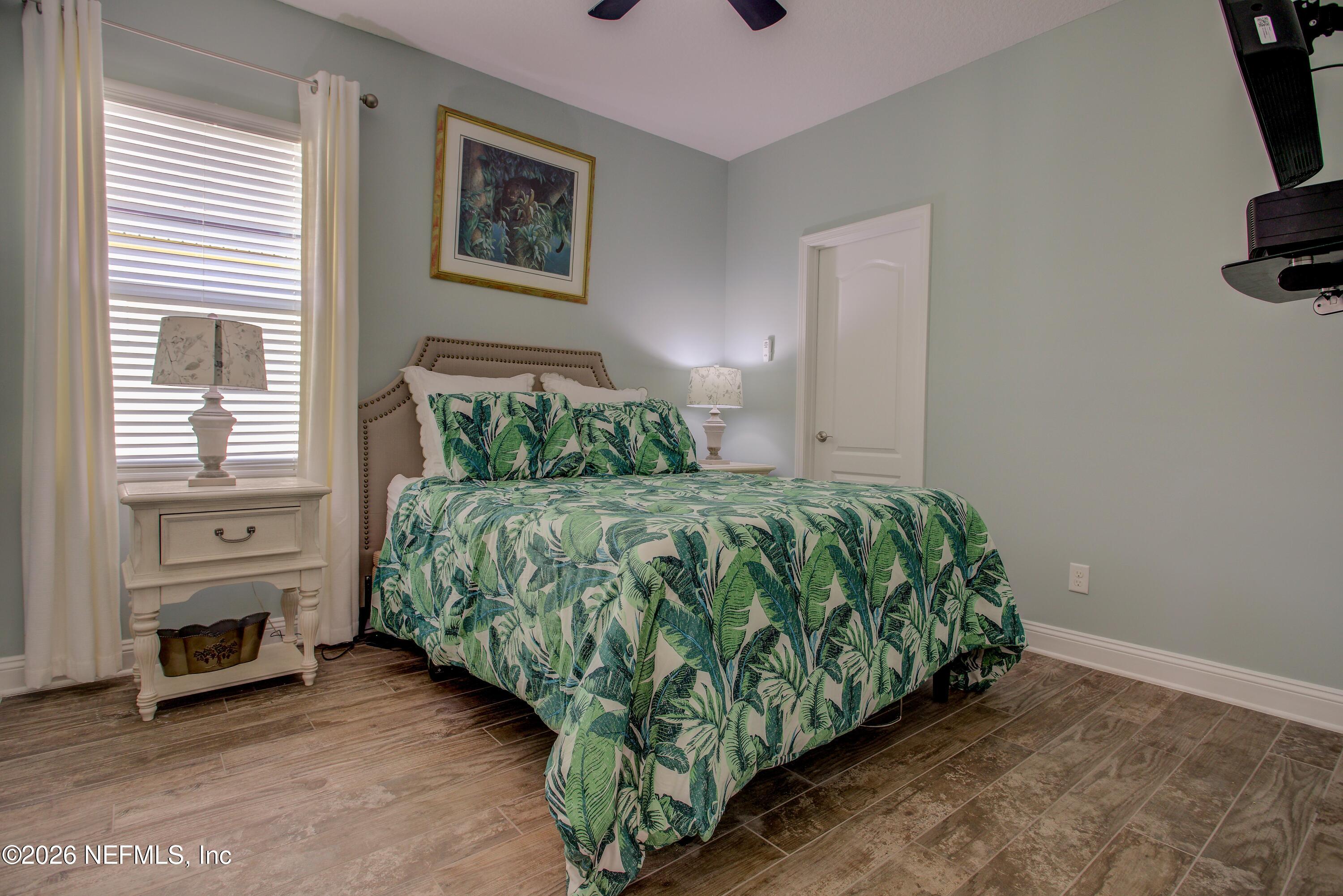394 Balearics Drive St. Augustine, FL 32086 - Photo 16 of 26 a bedroom with a bed and a window