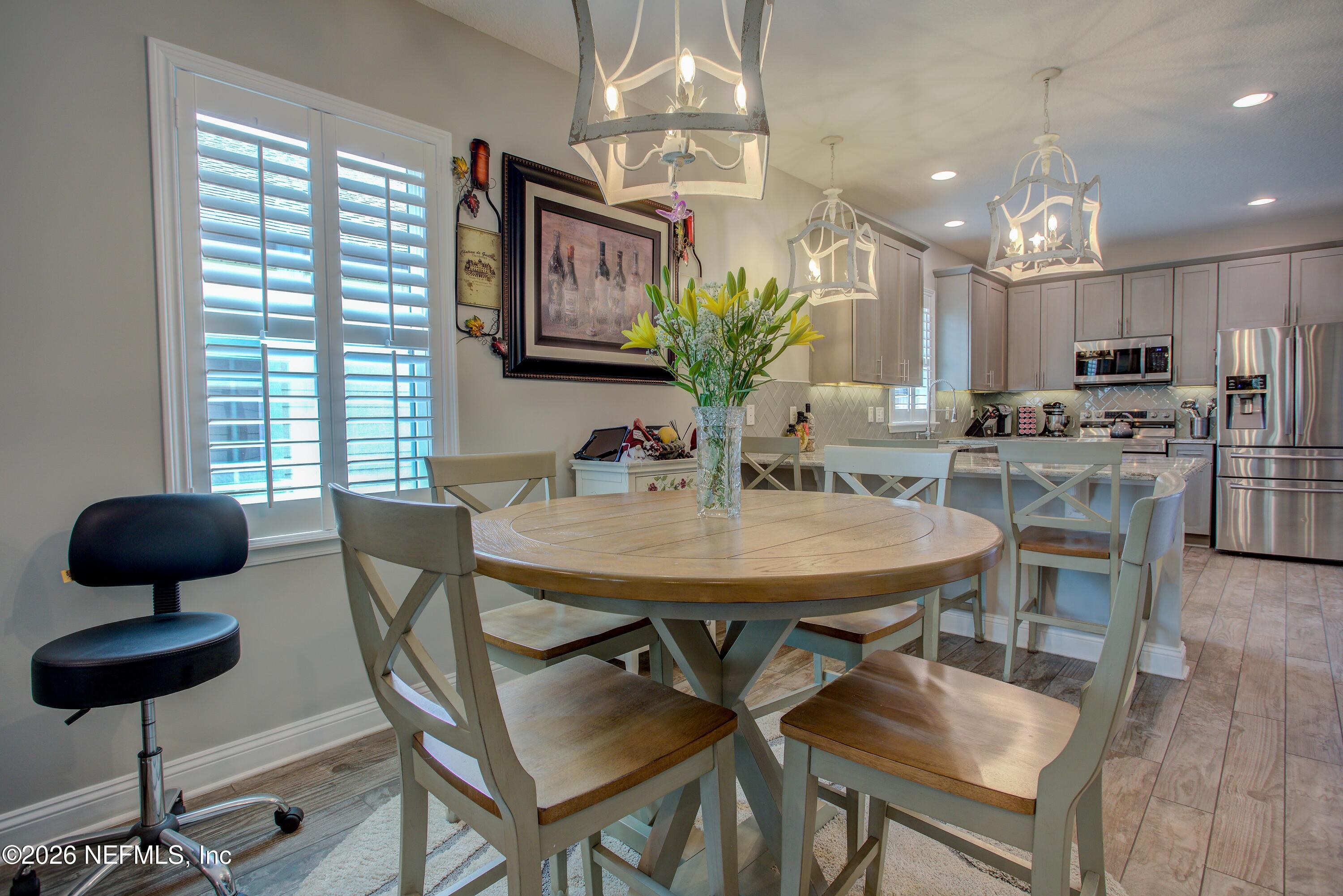 394 Balearics Drive St. Augustine, FL 32086 - Photo 10 of 26 a view of a dining room with furniture and chandelier