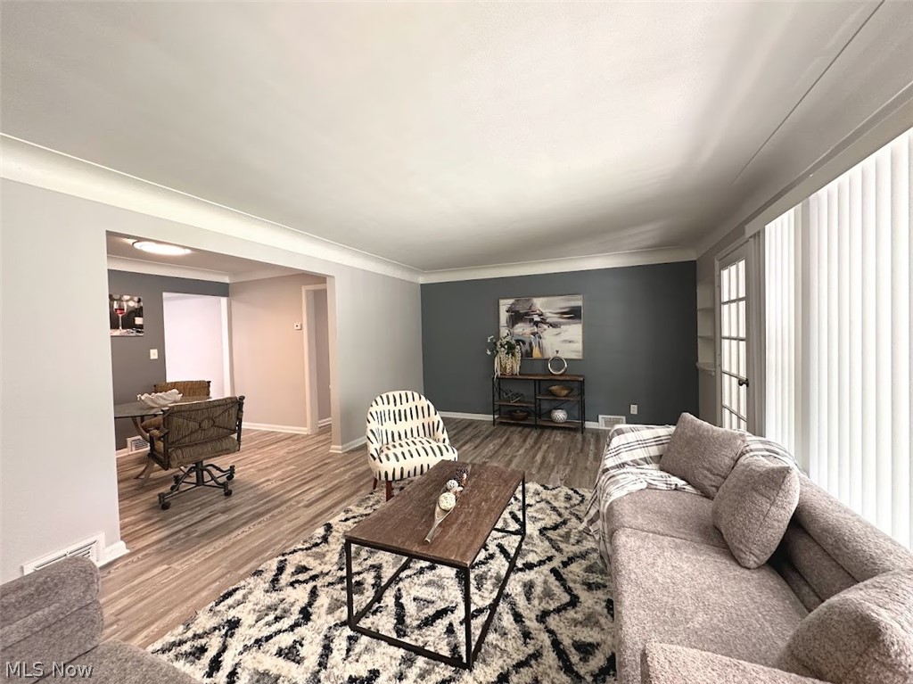 4227 Eastway Road South Euclid, OH 44121 - Photo 2 of 18 Living room with ornamental molding and hardwood / wood-style floors