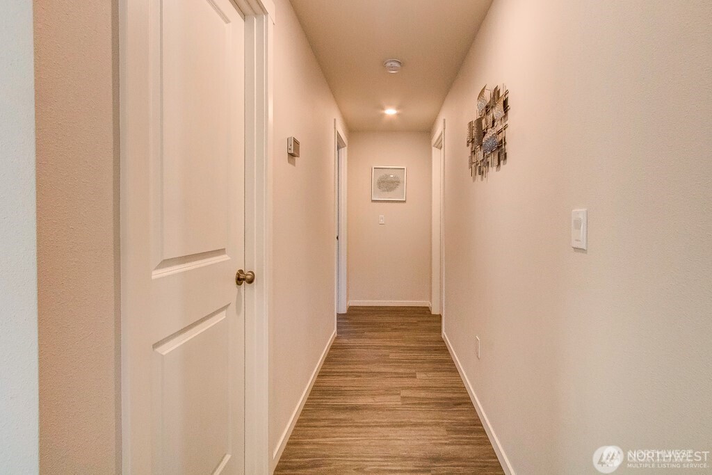 27 Jonagold Lane Manson, WA 98831 - Photo 16 of 32 a view of a hallway with wooden floor