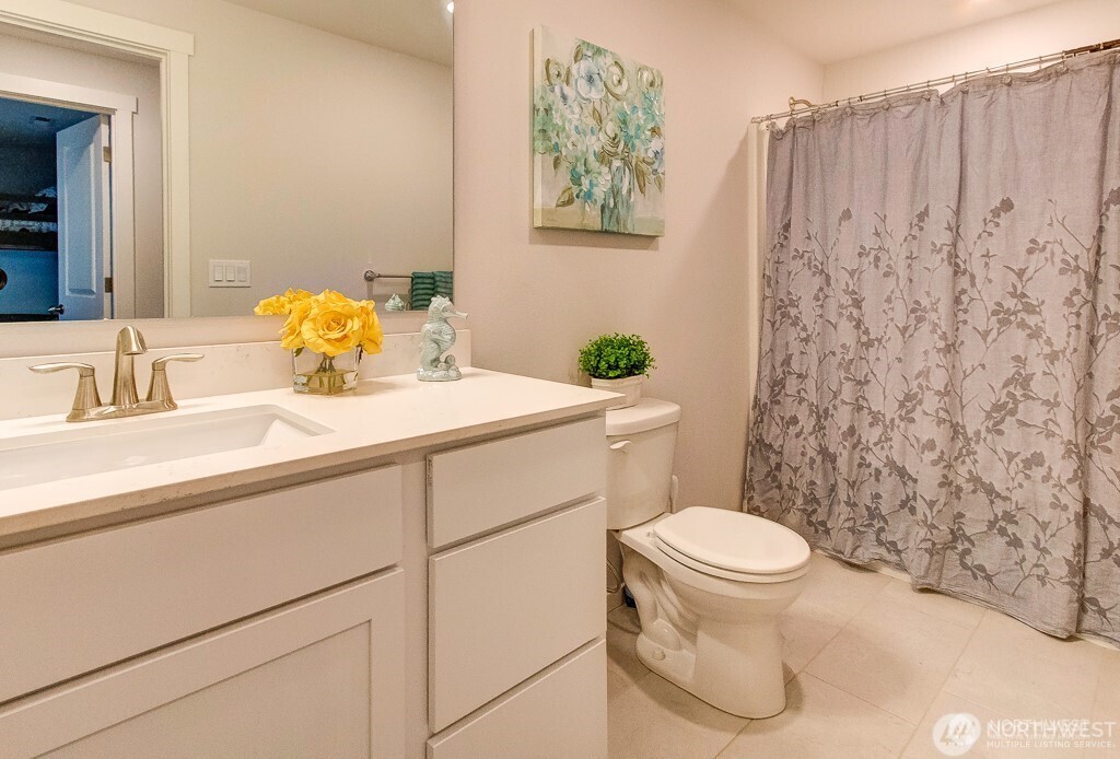 27 Jonagold Lane Manson, WA 98831 - Photo 17 of 32 a bathroom with a sink a toilet and a mirror