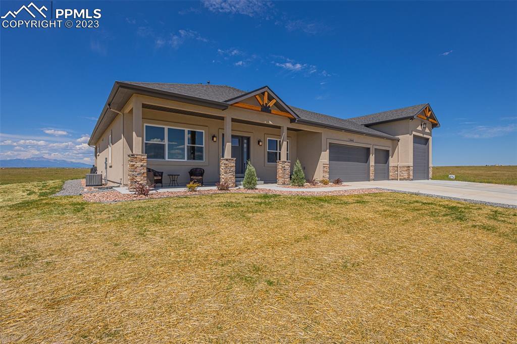 2960 Longhorn Rdg View Peyton, CO 80831 - Photo 2 of 49 a view of a house with a swimming pool