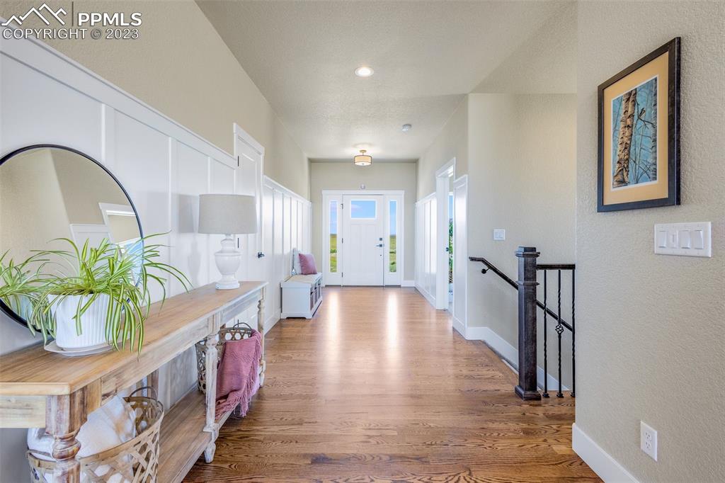 2960 Longhorn Rdg View Peyton, CO 80831 - Photo 4 of 49 a view of entryway with wooden floor