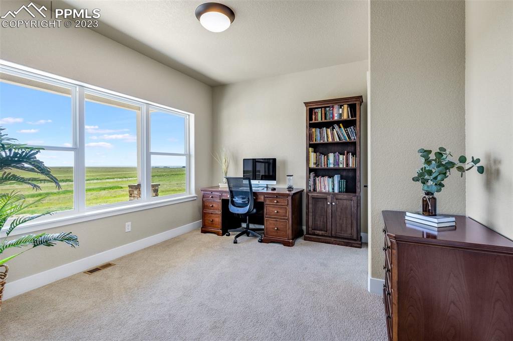 2960 Longhorn Rdg View Peyton, CO 80831 - Photo 5 of 49 a view of a workspace with furniture and a window