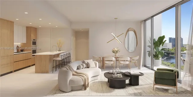 a living room with furniture a large window and a potted plant