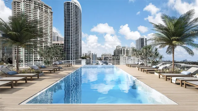 a view of swimming pool with outdoor seating and city view