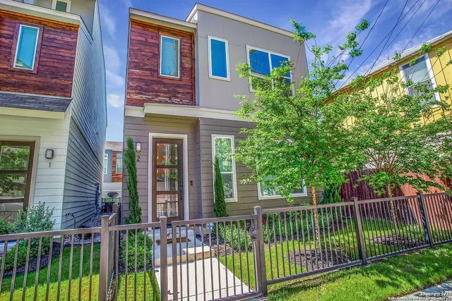 a view of a brick house with a large window