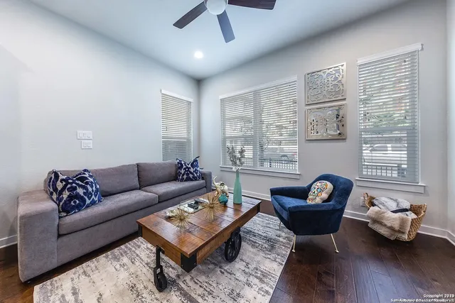 a living room with furniture and a window