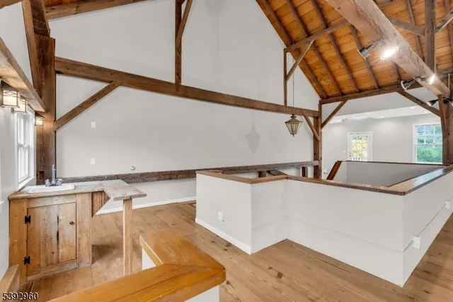 a kitchen with granite countertop a stove top oven microwave and cabinets
