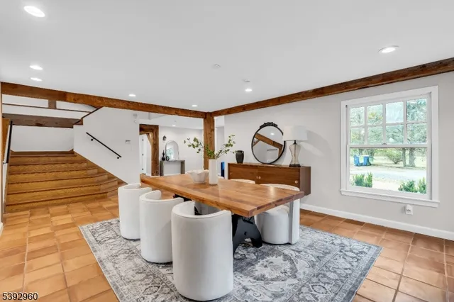 a bathroom with a toilet a sink and a mirror