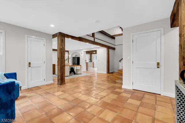 a view of a hallway with closet and bathroom