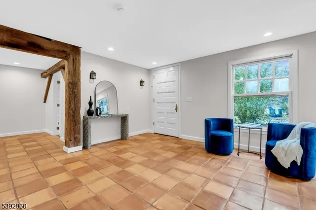 a view of kitchen with livingroom and window