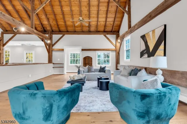 a living room with furniture a large window