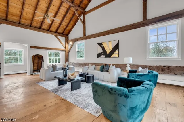 a living room with furniture large window and outer view