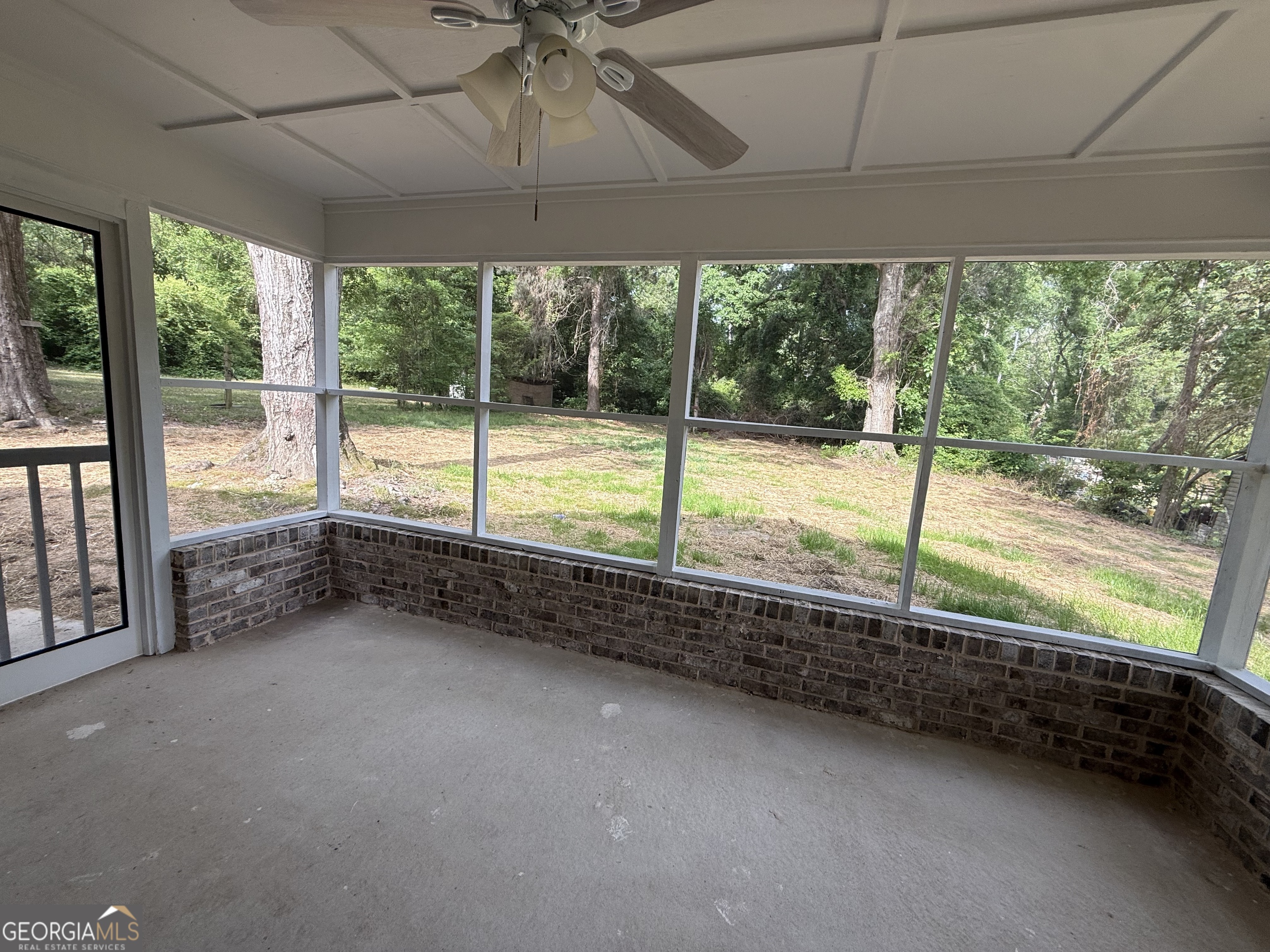 240 Sims Street Barnesville, GA 30204 - Photo 22 of 25 a view of an empty room with a large window