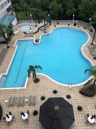 a view of a swimming pool and lounge chair