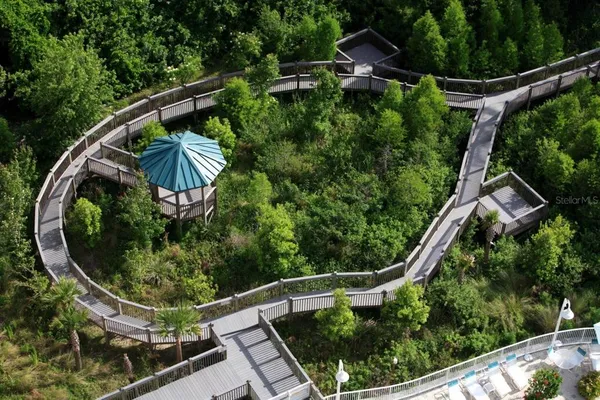 an aerial view of a house with swimming pool outdoor seating and entertaining space