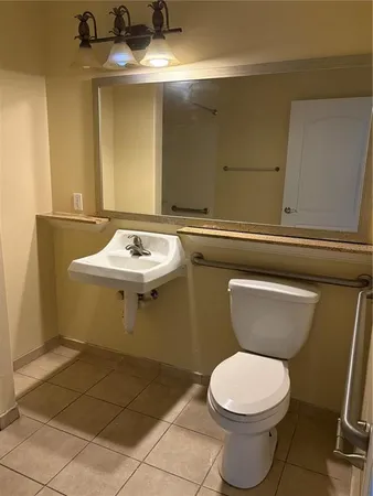 a bathroom with a toilet and a sink