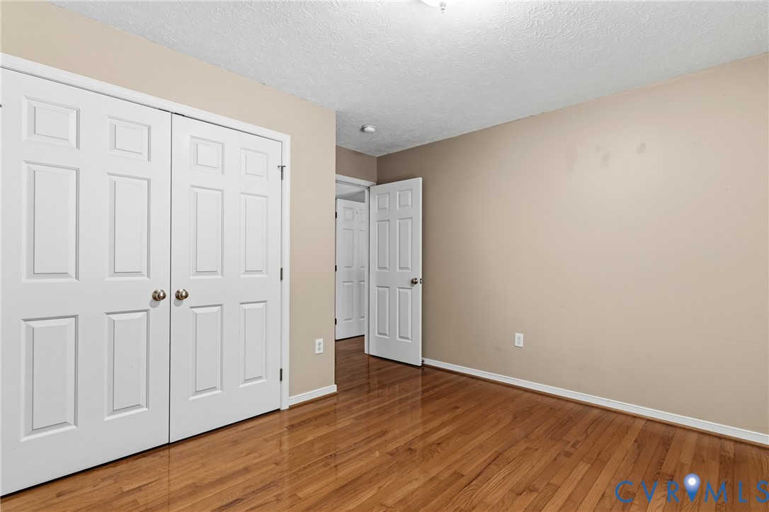 12654 Mt Olive Cohoke Road West Point, VA 23181 - Photo 22 of 31 a view of an empty room with wooden floor