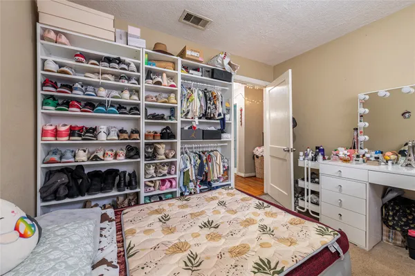 a bed room with a bed and a book shelf