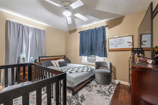 a bedroom with furniture and a window