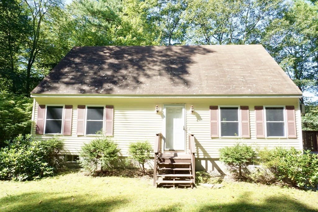 front view of a house with a yard