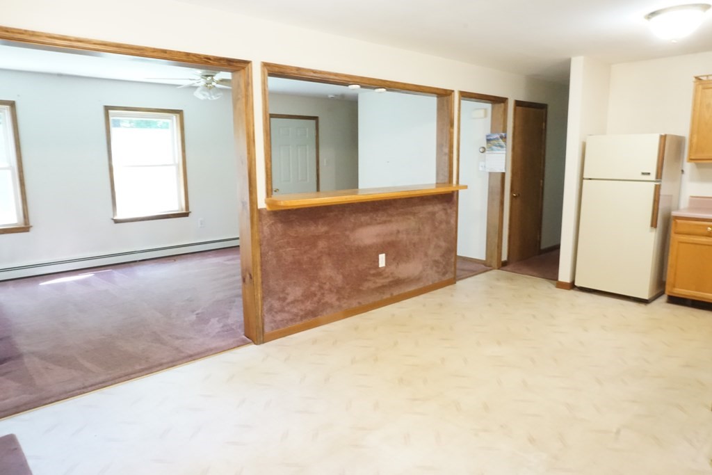 9 Pine Plain Road Georgetown, MA 01833 - Photo 4 of 26 view of a kitchen with refrigerator and mirror