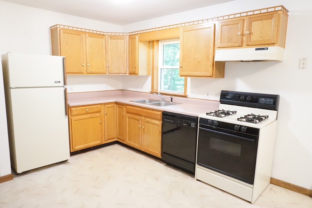 9 Pine Plain Road Georgetown, MA 01833 - Photo 5 of 26 a kitchen with a sink cabinets appliances and a window