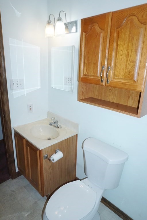 9 Pine Plain Road Georgetown, MA 01833 - Photo 10 of 26 a bathroom with a sink a toilet and mirror