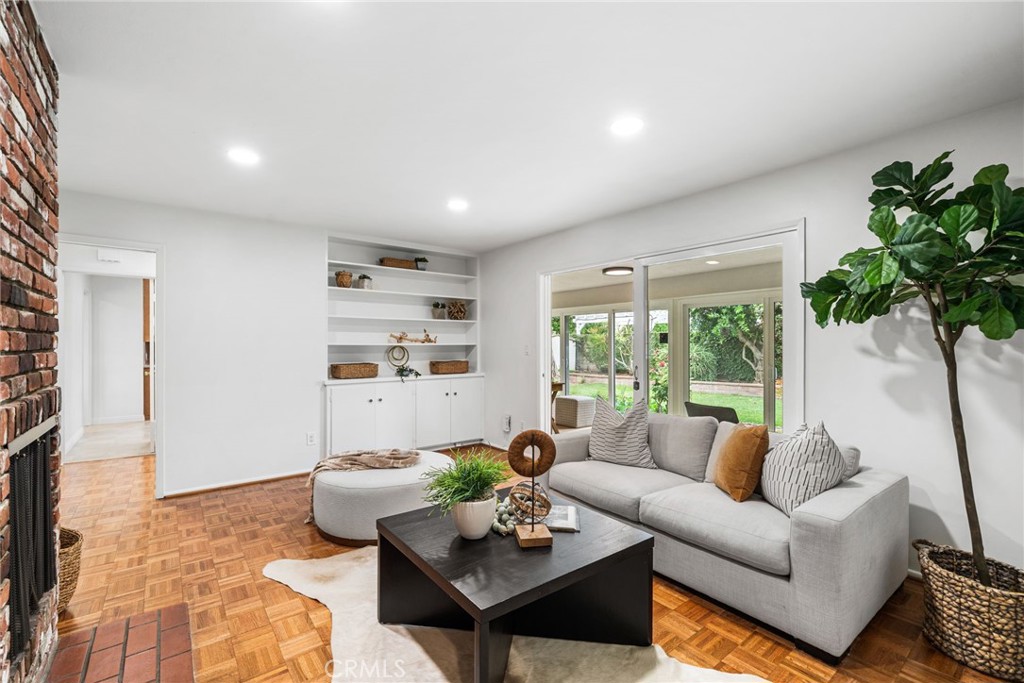 1107 Sharon Road Santa Ana, CA 92706 - Photo 11 of 37 a living room with furniture and a large window