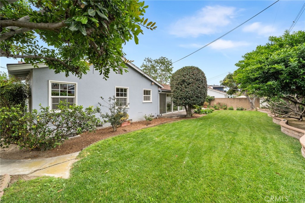 1107 Sharon Road Santa Ana, CA 92706 - Photo 16 of 37 a front view of a house with a yard