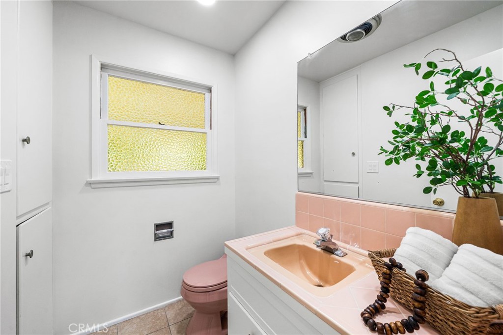 1107 Sharon Road Santa Ana, CA 92706 - Photo 20 of 37 a bathroom with a sink toilet and vanity