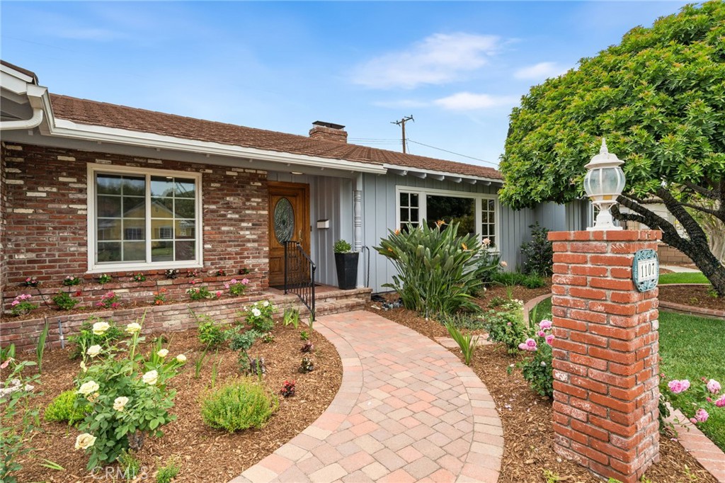 1107 Sharon Road Santa Ana, CA 92706 - Photo 2 of 37 front view of house with a yard