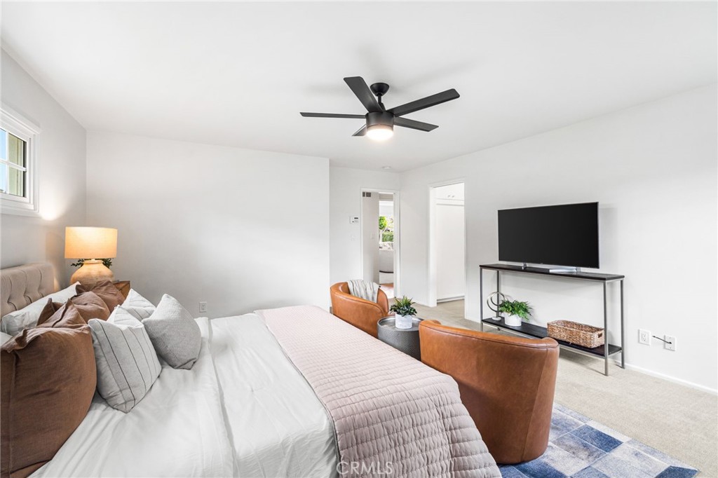 1107 Sharon Road Santa Ana, CA 92706 - Photo 22 of 37 a bedroom with a bed and a flat screen tv