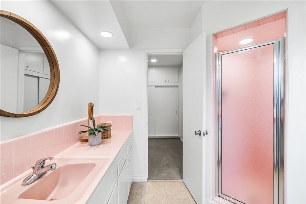 1107 Sharon Road Santa Ana, CA 92706 - Photo 24 of 37 a bathroom with a sink and a mirror