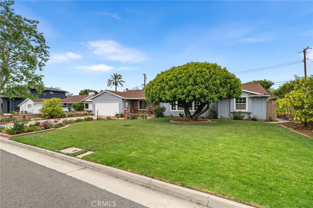 1107 Sharon Road Santa Ana, CA 92706 - Photo 28 of 37 a front view of a house with a garden