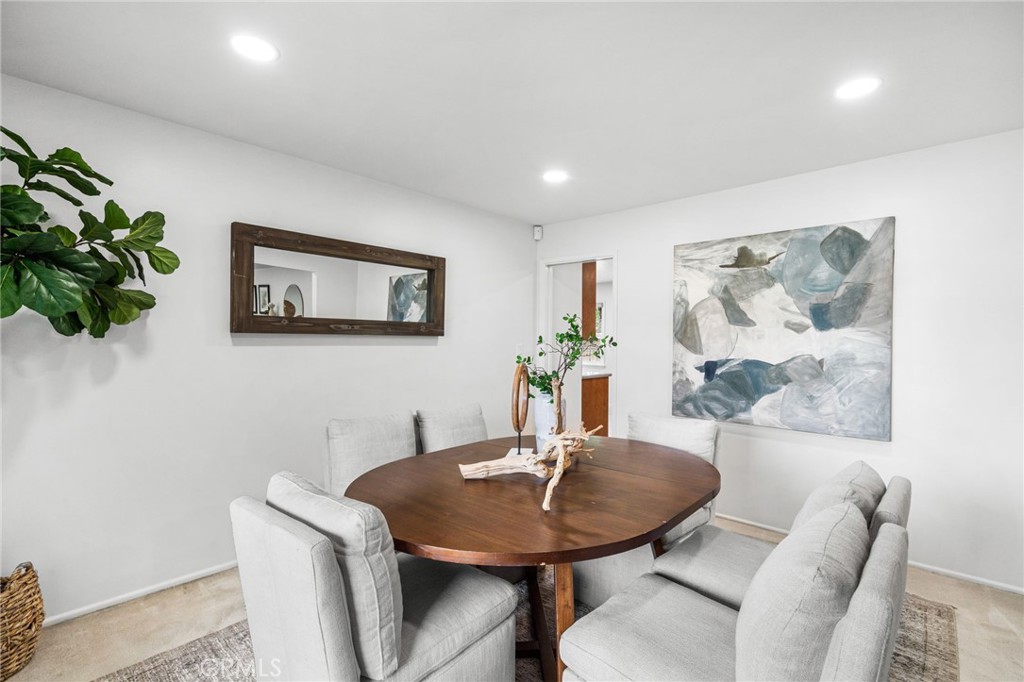 1107 Sharon Road Santa Ana, CA 92706 - Photo 29 of 37 a view of a dining room with furniture and wooden floor