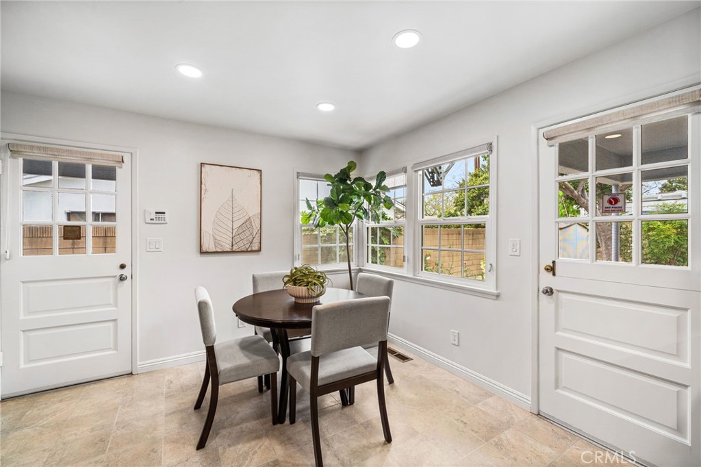 1107 Sharon Road Santa Ana, CA 92706 - Photo 31 of 37 a dining room with furniture and window