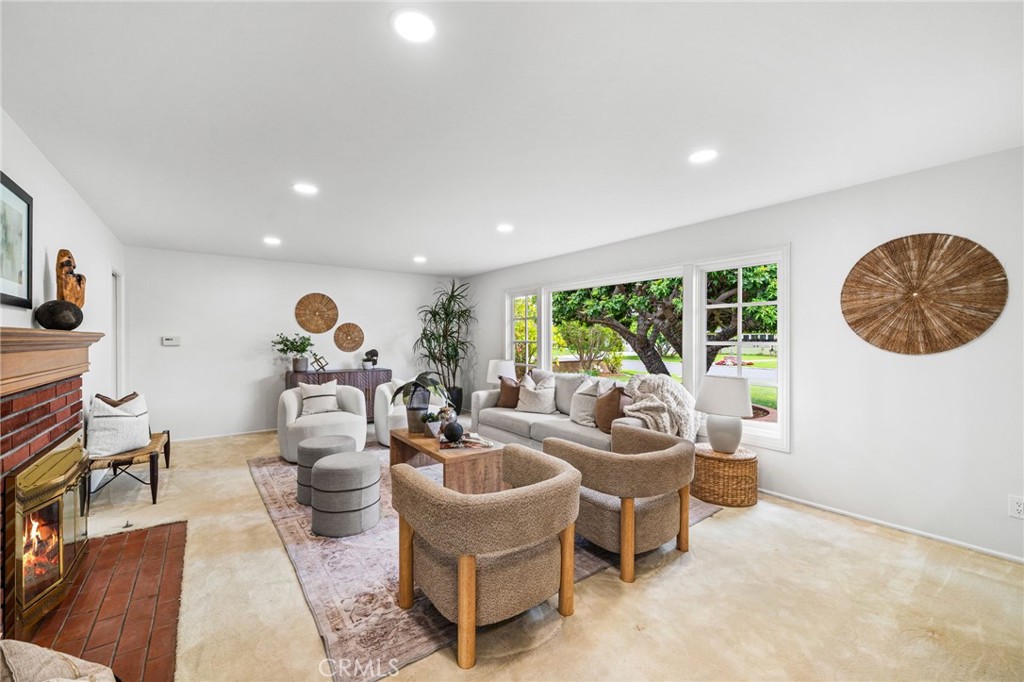 1107 Sharon Road Santa Ana, CA 92706 - Photo 5 of 37 a living room with furniture and a large window