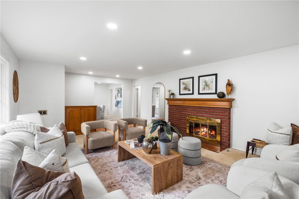 1107 Sharon Road Santa Ana, CA 92706 - Photo 6 of 37 a living room with furniture and a fireplace