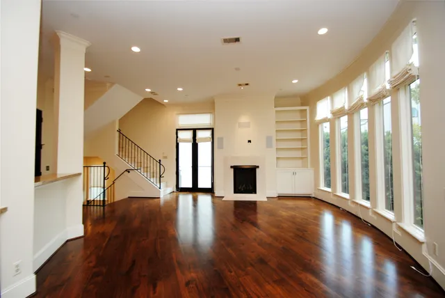 a bathroom with a toilet a sink and a window