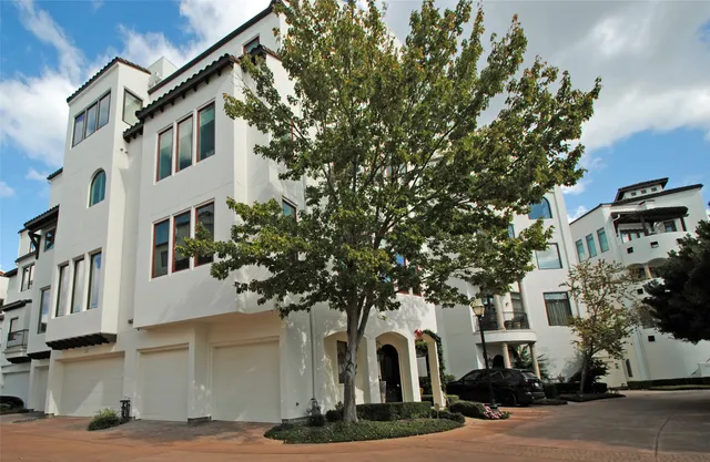 a view of staircase with railing and a chandelier