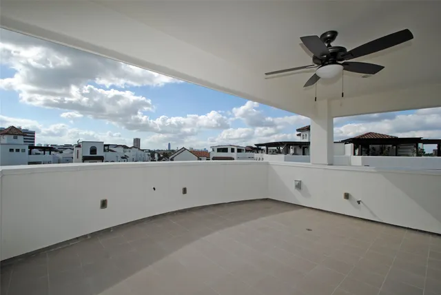 a view of a white house with a big yard and a large tree