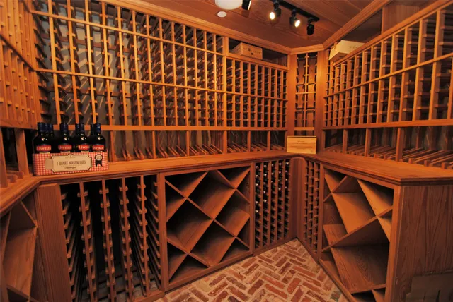 a view of walk in closet with wooden floor