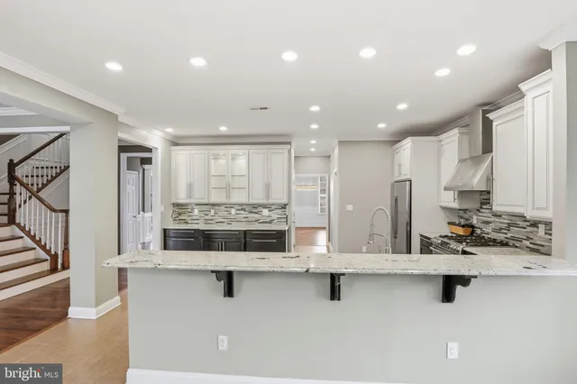 a view of a livingroom with wooden floor and fireplace