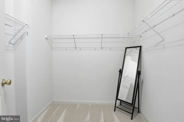 a bathroom with a bathtub a mirror a vanity and a shower