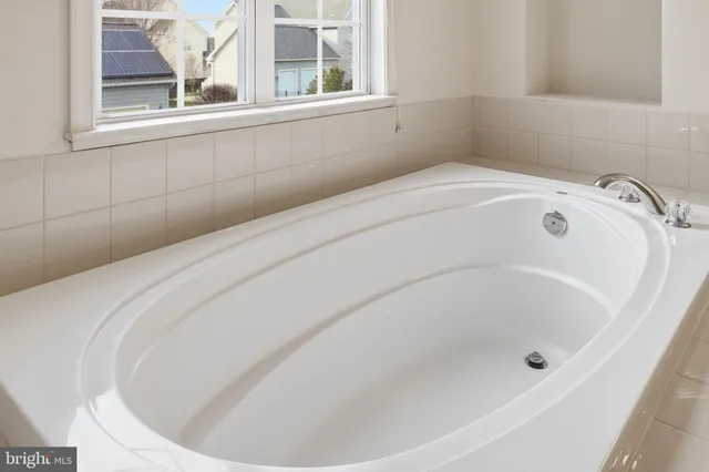 a view of a bathroom with shower sink and mirror