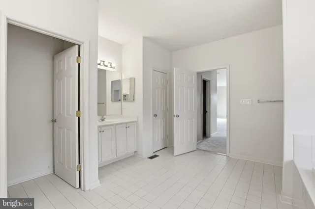 a view of a livingroom with a window and a ceiling fan